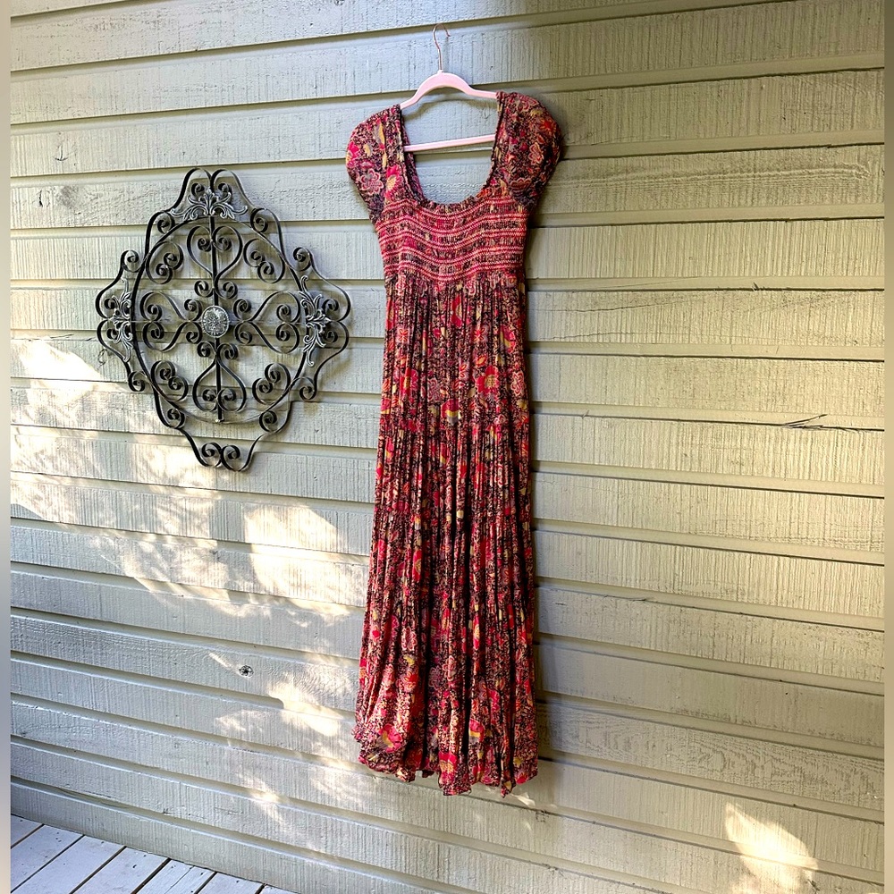 Free People fabulous maxi dress. Shirred top . Perfect for spring and summer .